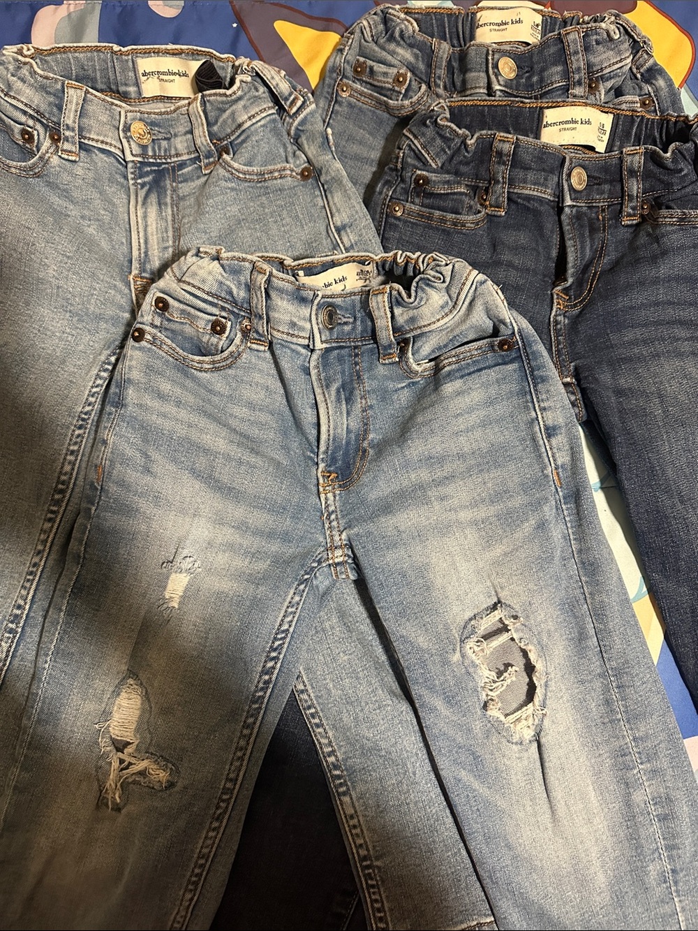 abercrombie kids light blue and dark blue distressed jeans